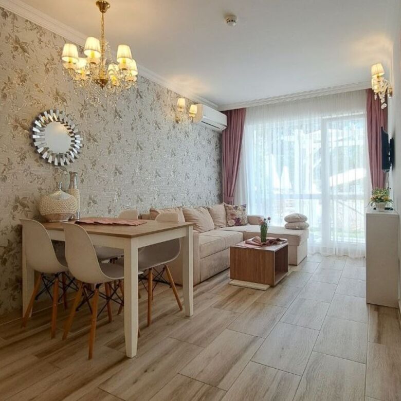 Bright living room with modern decor and large windows in Sweet Homes 6, Sunny Beach.