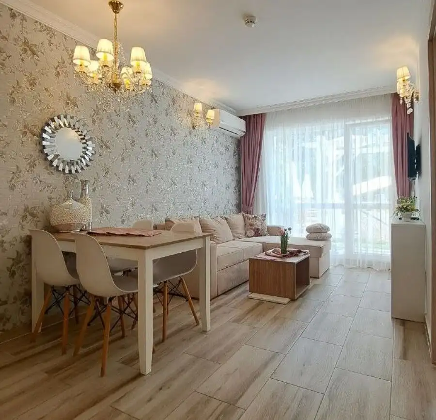 Bright living room with modern decor and large windows in Sweet Homes 6, Sunny Beach.
