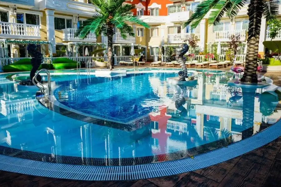 Modern swimming pool with palm trees at Sweet Homes 6, Sunny Beach.