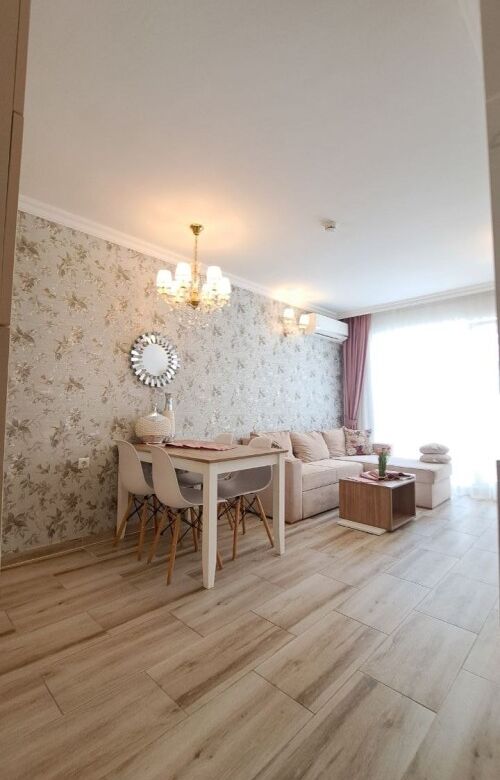 Bright 1-bedroom apartment in Sunny Beach with stylish decor and spacious living area.