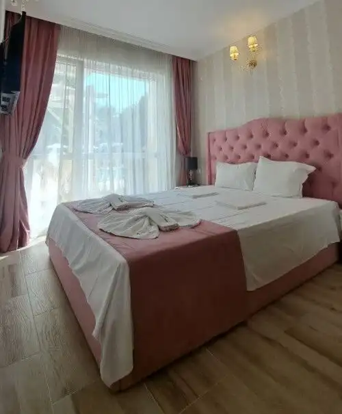 Modern 1-bedroom apartment with pink decor in Sunny Beach, near the beach and amenities.