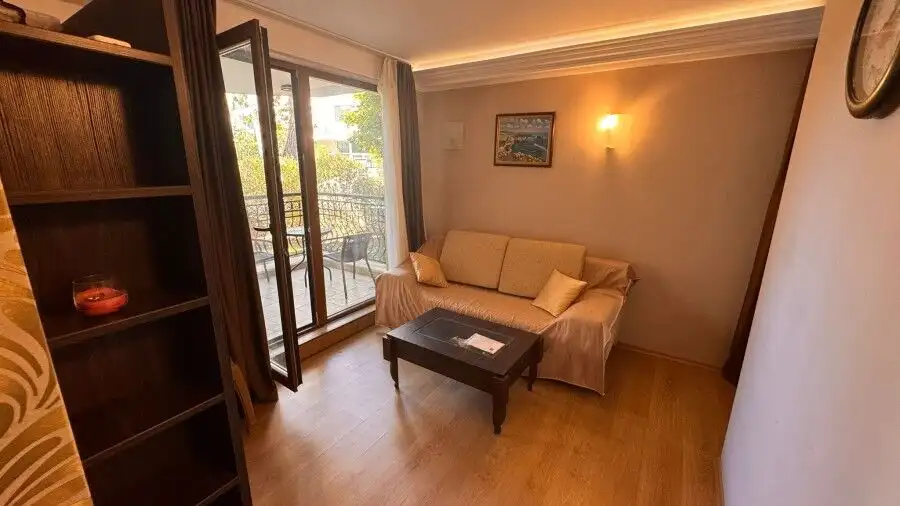 Bright 1-bedroom ground floor apartment in Harmony Palace, Sunny Beach, with living area and balcony.