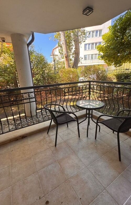 Ground floor apartment balcony with outdoor seating in Sunny Beach, Bulgaria.