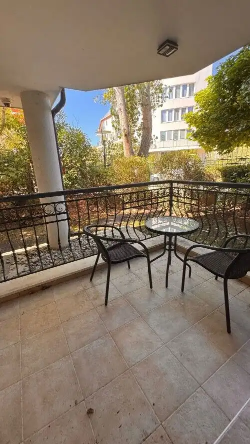 Ground floor apartment balcony with outdoor seating in Sunny Beach, Bulgaria.