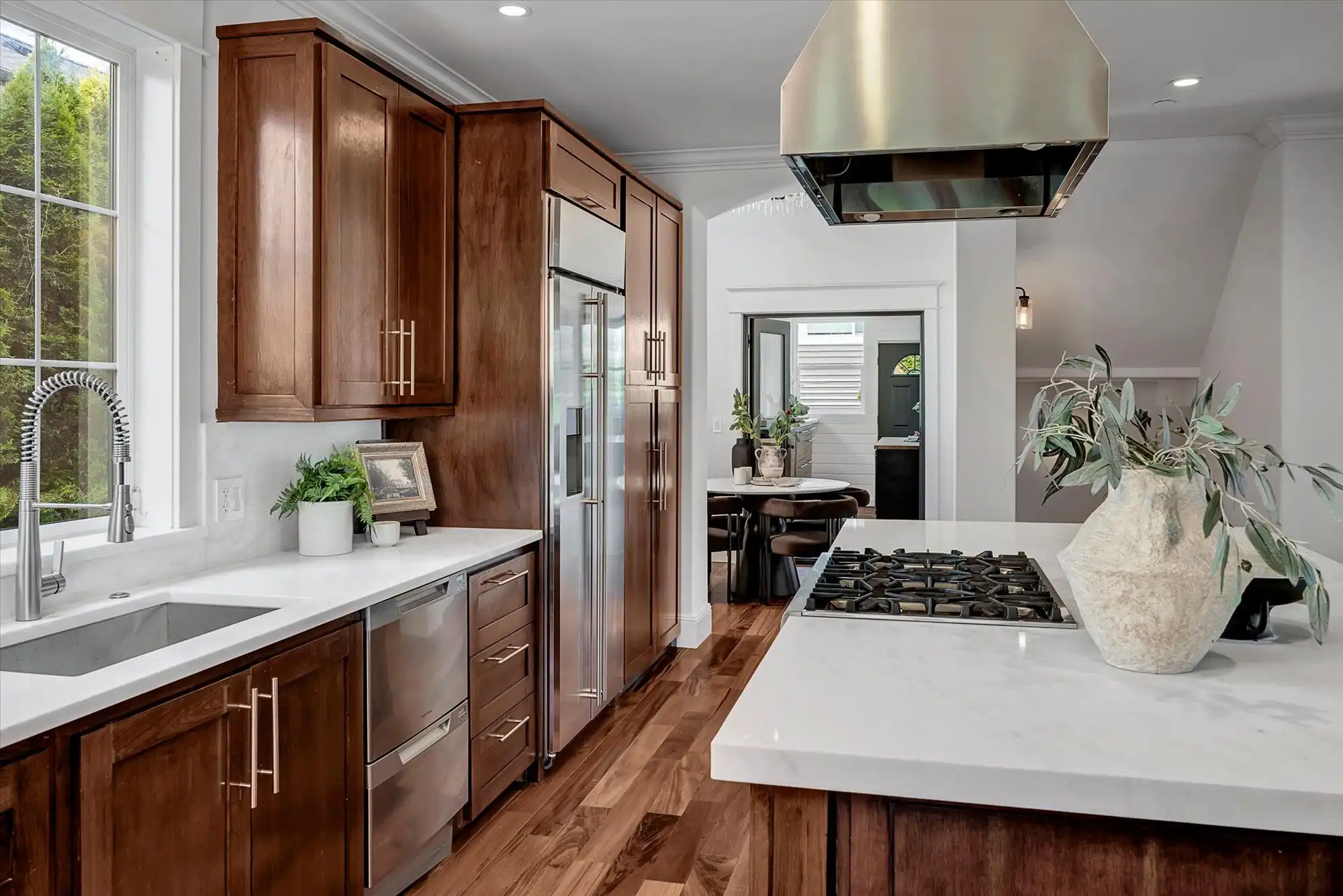 Elegant kitchen featuring custom wood cabinets and modern appliances in a stunning lakefront home.