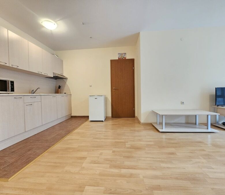 Apartment interior with open-plan kitchen and living area in Privilege Fort, Elenite Resort.