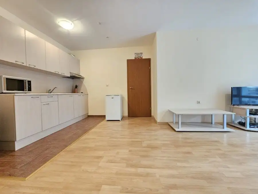 Apartment interior with open-plan kitchen and living area in Privilege Fort, Elenite Resort.