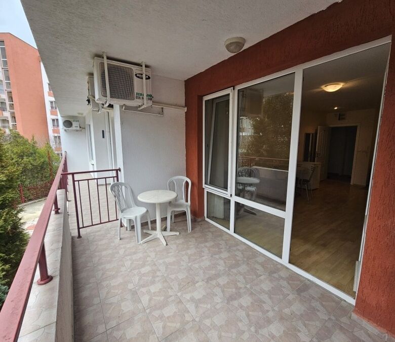 Sea view balcony with outdoor furniture in a modern apartment.