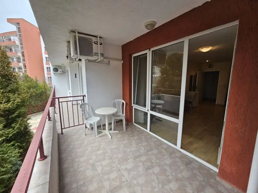 Sea view balcony with outdoor furniture in a modern apartment.