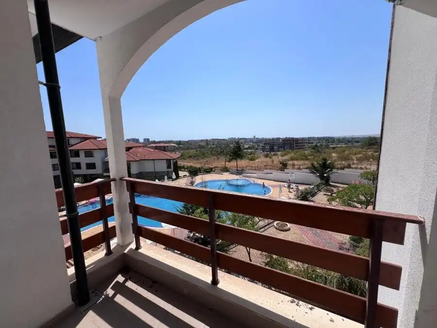 Balcony overlooking Sunny Beach with pool and landscape views, perfect for relaxing in a spacious st.