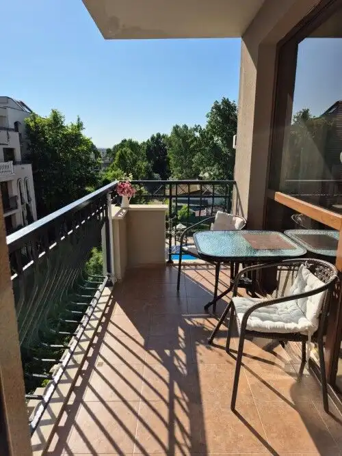 Balcony overlooking lush greenery and trees at Cascadas Family Resort, Sunny Beach. Perfect for rela.