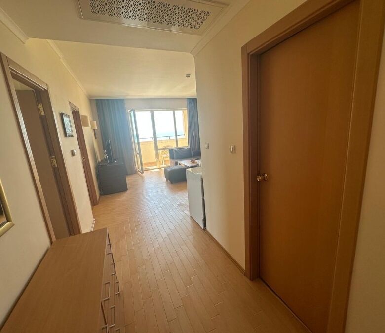 Sea view apartment in Sunny Beach with modern interior and balcony overlooking the ocean.