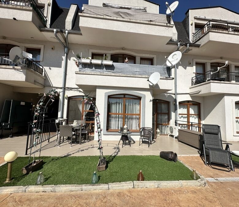 Apartment with balcony, outdoor furniture, and satellite dishes in Nessebar.