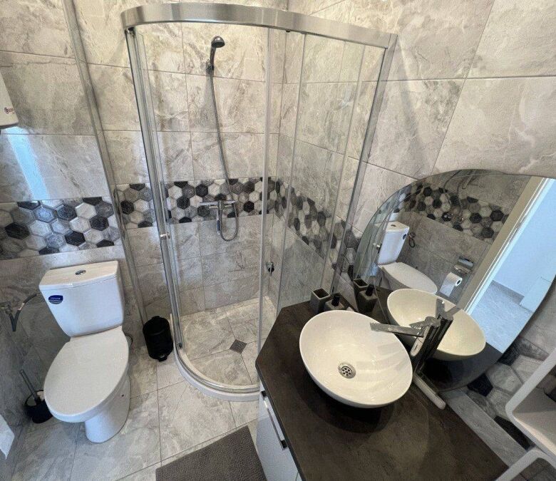 Bathroom with shower, toilet, and contemporary sink in Millennium 2 Sveti Vlas.