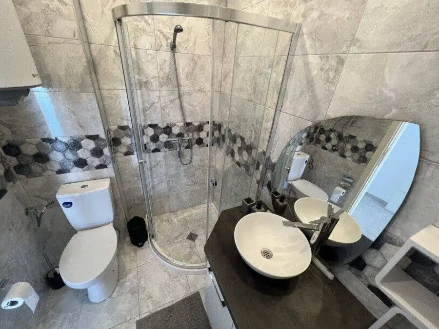 Bathroom with shower, toilet, and contemporary sink in Millennium 2 Sveti Vlas.