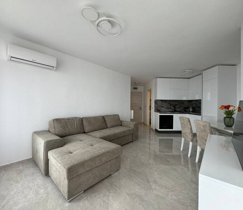 Bright living room in a 1-bedroom sea view apartment in Sveti Vlas, close to the beach.