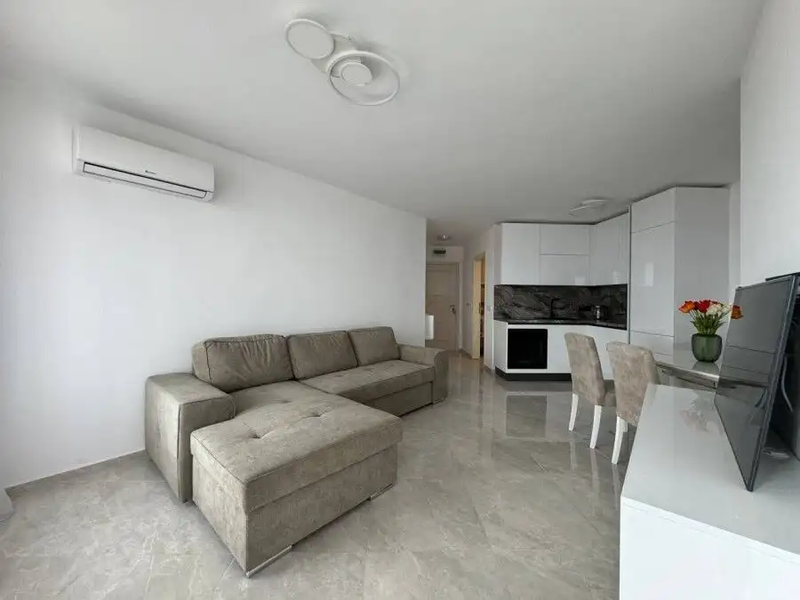 Bright living room in a 1-bedroom sea view apartment in Sveti Vlas, close to the beach.