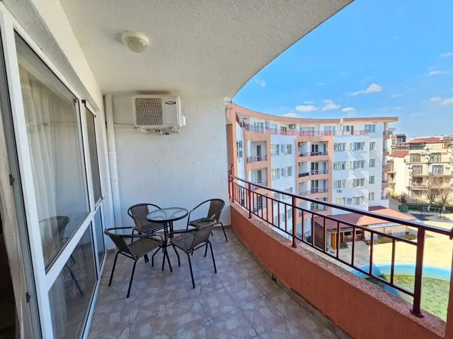 Balcony view of Riviera Fort apartment with sea view and outdoor seating.