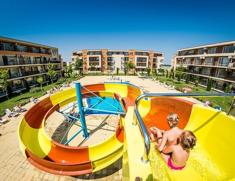 Kids enjoying water slide at Nessebar Fort Club resort in Bulgaria.