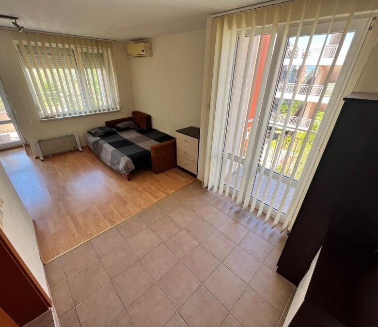 Furnished studio apartment of 54 sq.m. with 2 balconies, bright interior, and modern amenities in Ne.