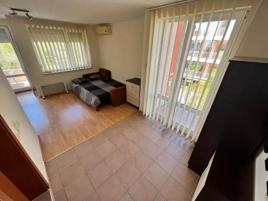 Furnished studio apartment of 54 sq.m. with 2 balconies, bright interior, and modern amenities in Ne.