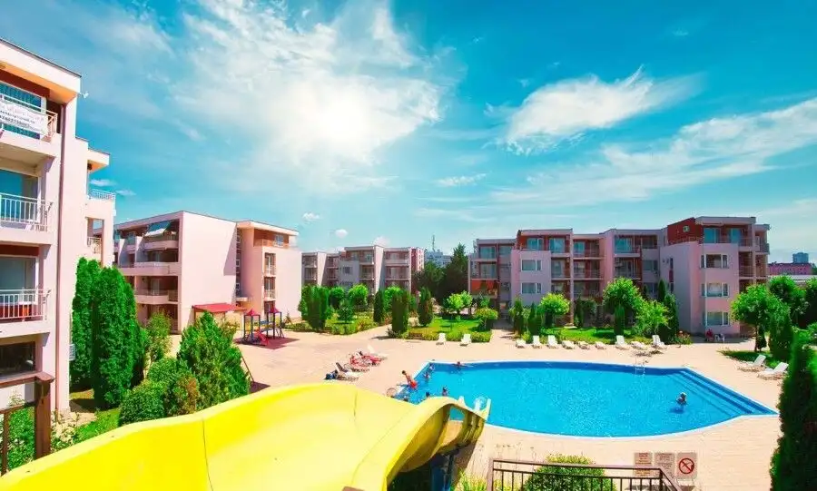 View of the Nessebar Fort Club residential complex with pool and green areas.