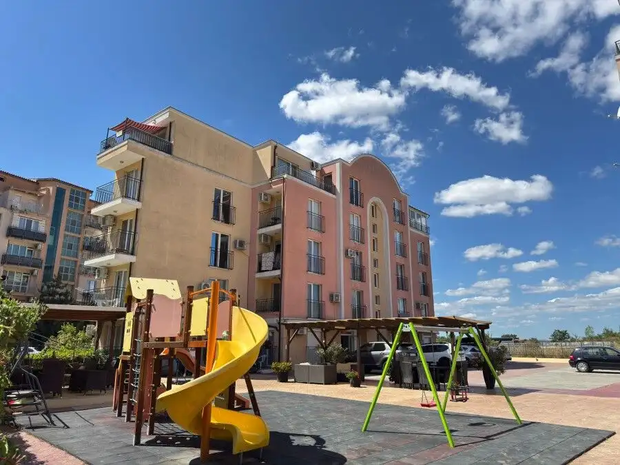 Contemporary residential complex close to Sunny Beach, featuring a playground and spacious balconies.