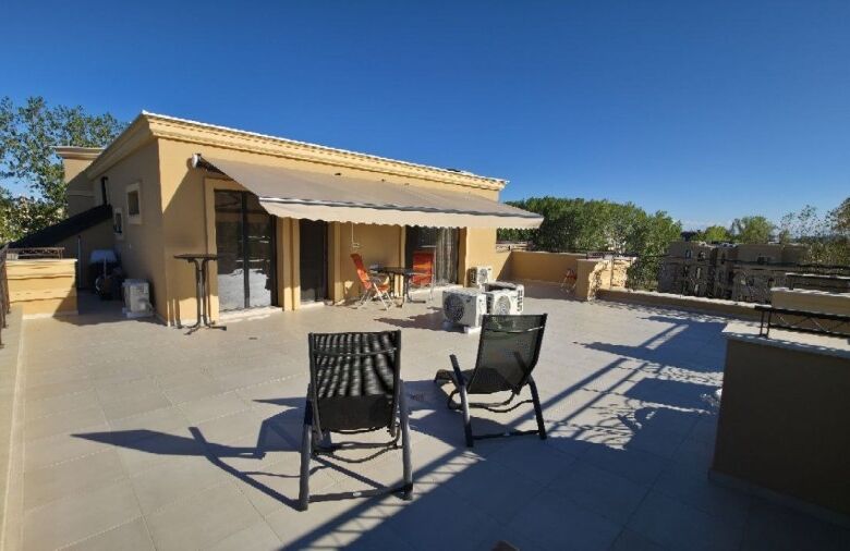 Spacious terrace of luxury penthouse with seating area in Aphrodite Green, Sunny Beach.