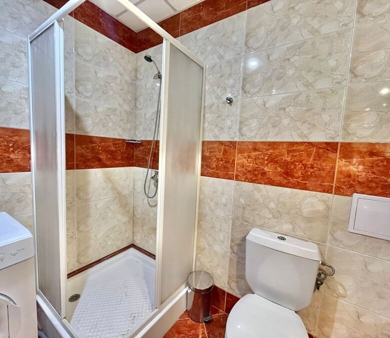 Bright bathroom with shower and toilet in Riviera Fort, Ravda.
