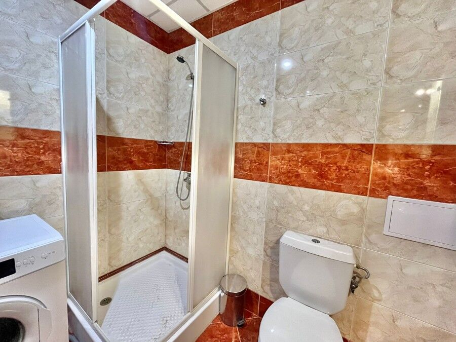 Bright bathroom with shower and toilet in Riviera Fort, Ravda.