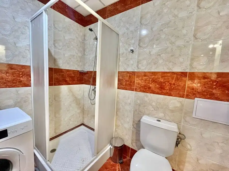 Bright bathroom with shower and toilet in Riviera Fort, Ravda.