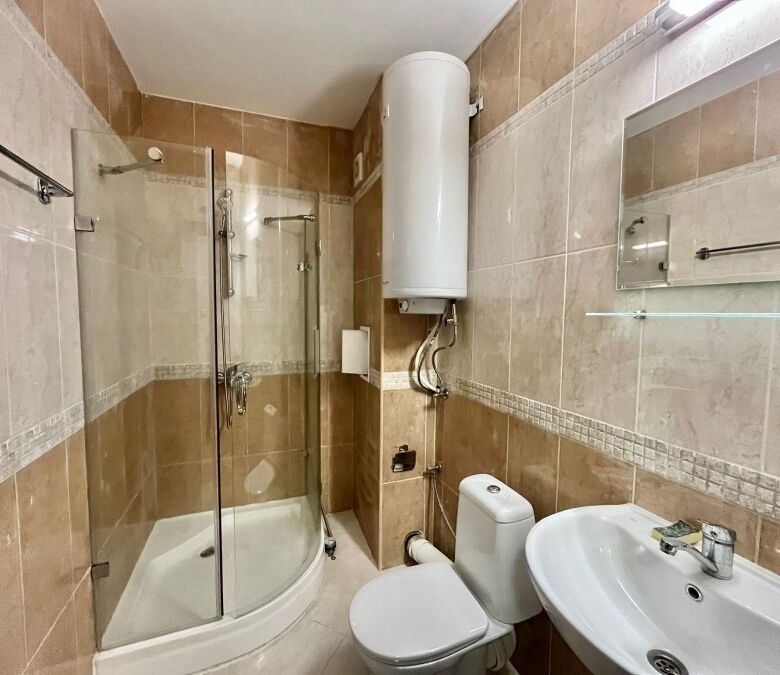 Spacious bathroom with shower cabin in a ground floor apartment near the sea in Ravda.