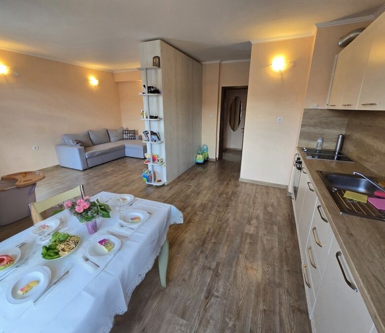 Modern 1-bedroom apartment with open-plan living and kitchen area, located just 80 meters from the b.