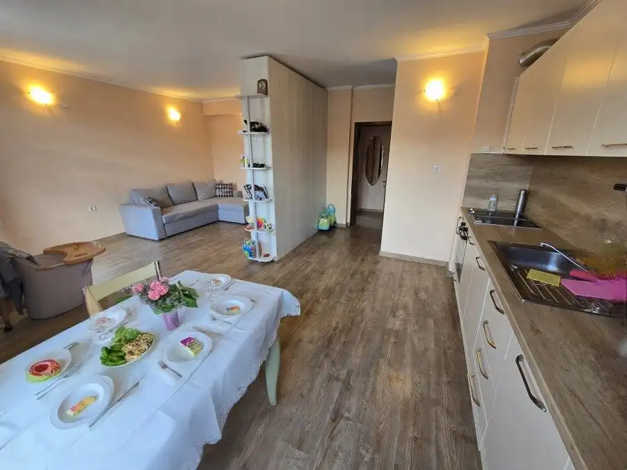 Modern 1-bedroom apartment with open-plan living and kitchen area, located just 80 meters from the b.