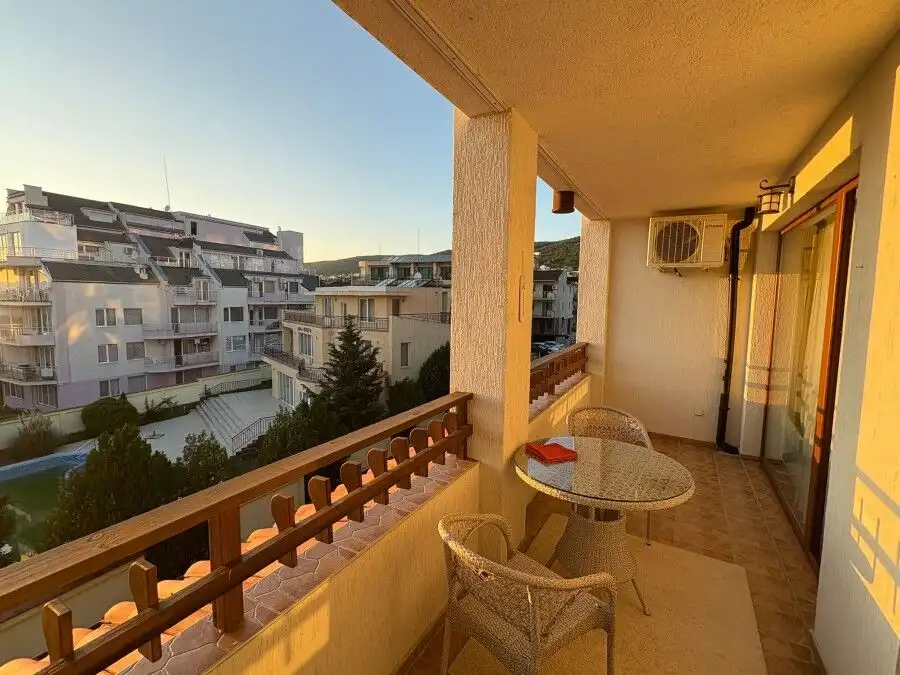 Balcony with outdoor seating overlooking residential buildings in Sveti Vlas, just 150m from the sea.