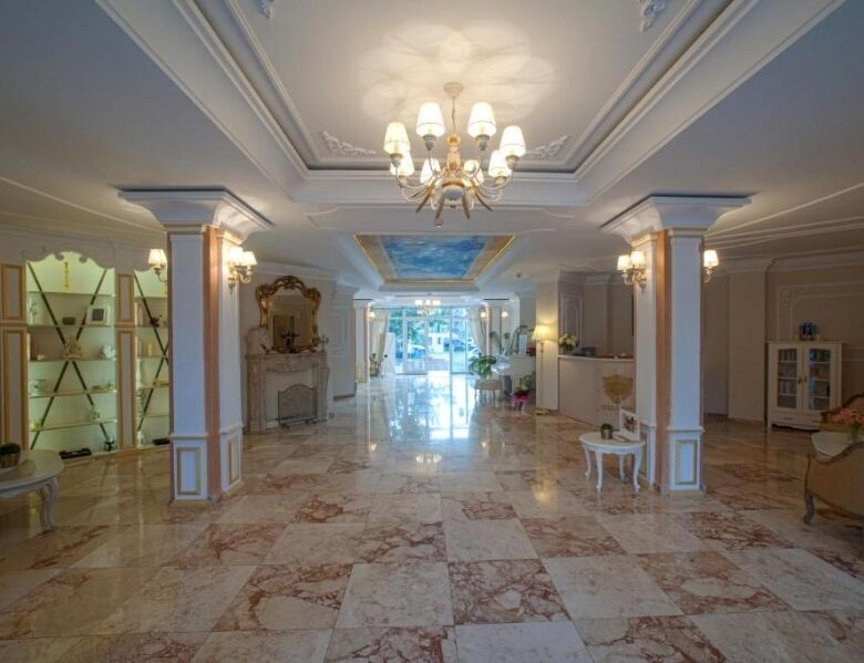 Elegant hotel lobby with classic decor and marble flooring in Sunny Beach.