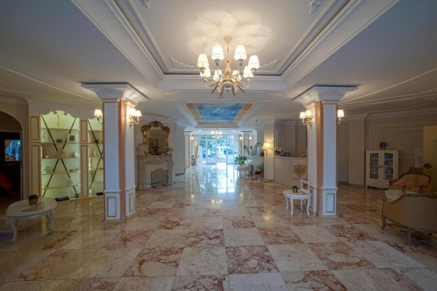 Elegant hotel lobby with classic decor and marble flooring in Sunny Beach.