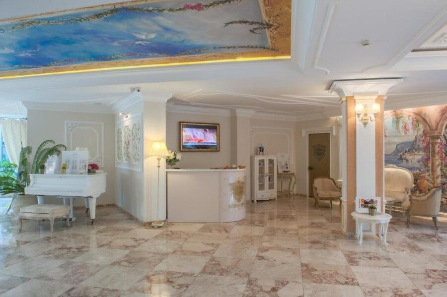 Luxurious hotel lobby with elegant decor, comfortable seating, and ambient lighting in a high-end re.