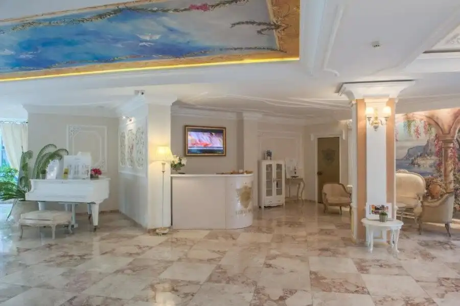 Luxurious hotel lobby with elegant decor, comfortable seating, and ambient lighting in a high-end re.