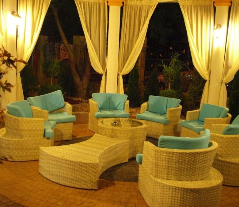 Outdoor lounge area with wicker furniture and large terrace in Sunny Beach.