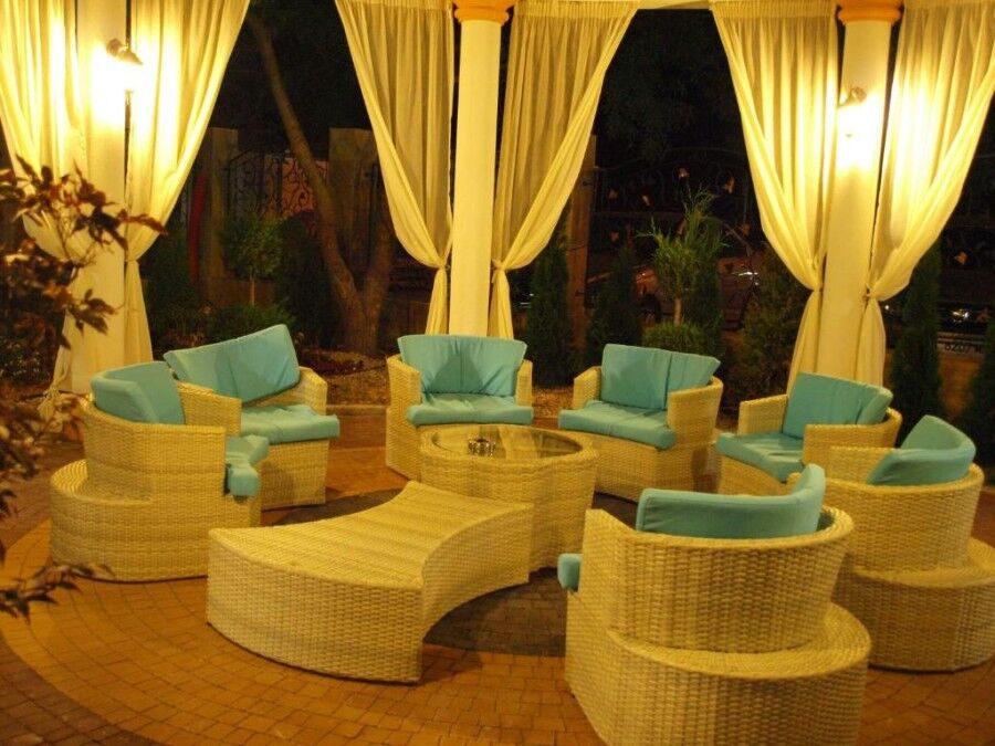 Outdoor lounge area with wicker furniture and large terrace in Sunny Beach.