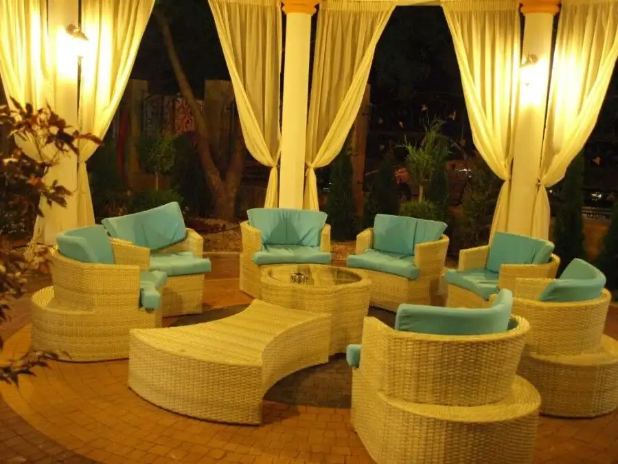 Outdoor lounge area with wicker furniture and large terrace in Sunny Beach.