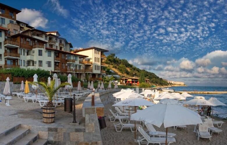 Sea view beachfront apartment in Sveti Vlas with modern amenities and scenic coastal surroundings.