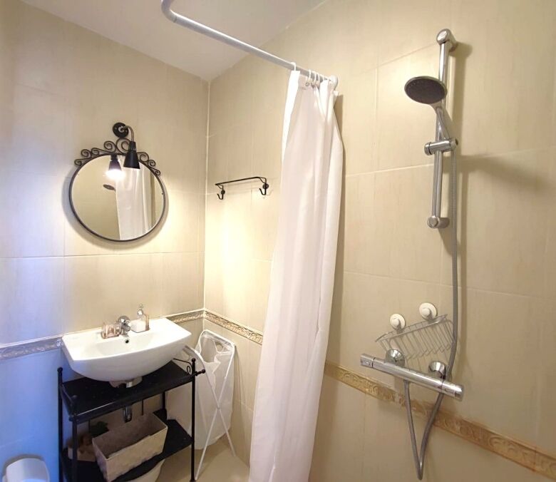 Bathroom with shower and modern fixtures in Pomorie residence.
