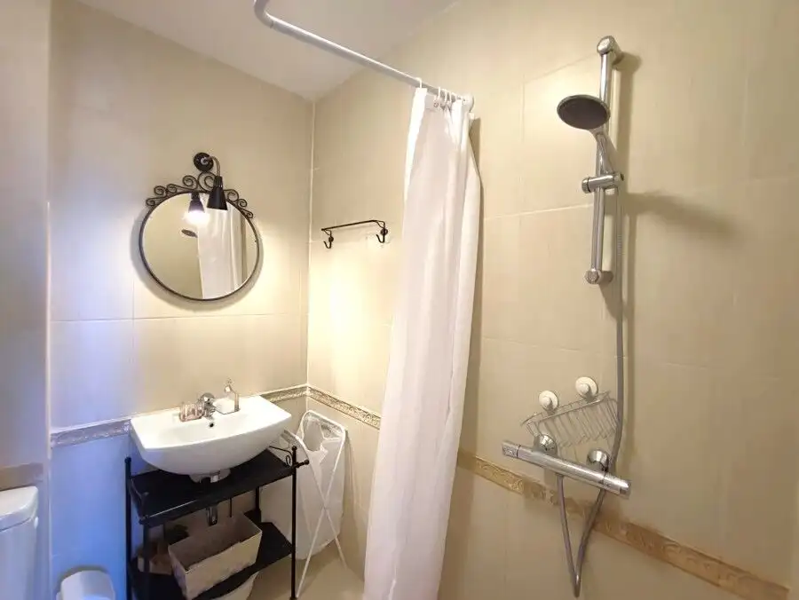 Bathroom with shower and modern fixtures in Pomorie residence.