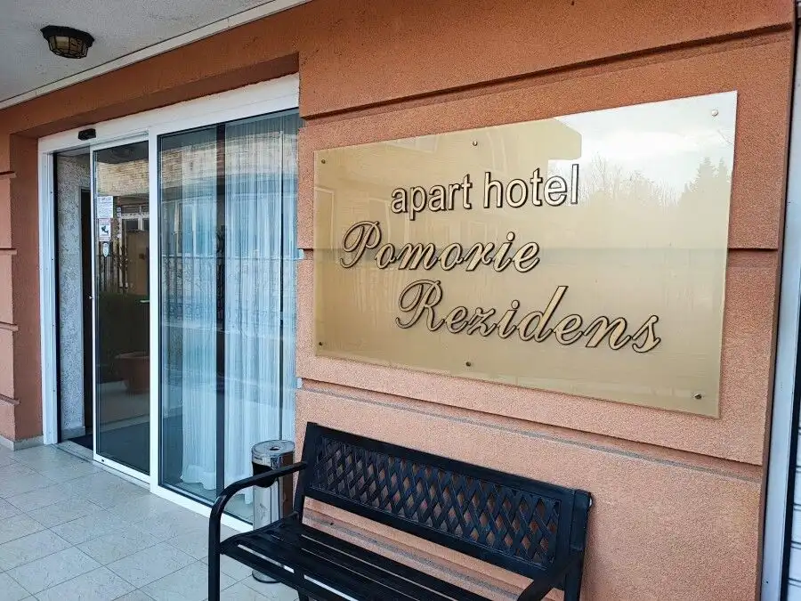 Apartment hotel Pomorie Residence sign on building exterior.