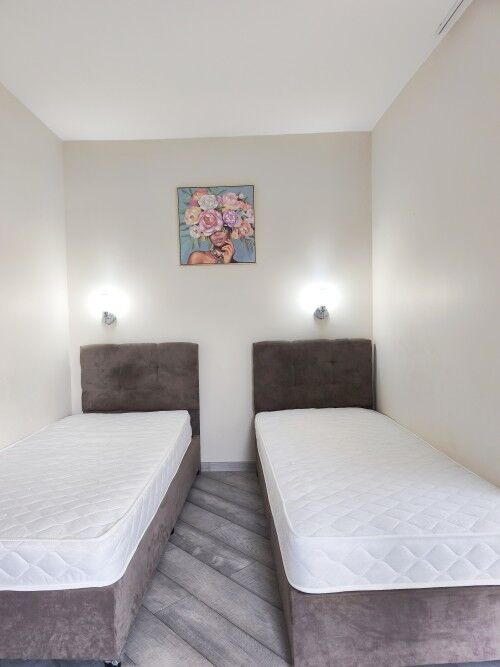 Interior of renovated 1-bedroom apartment with two beds in Semiramida Gardens, Sunny Beach.