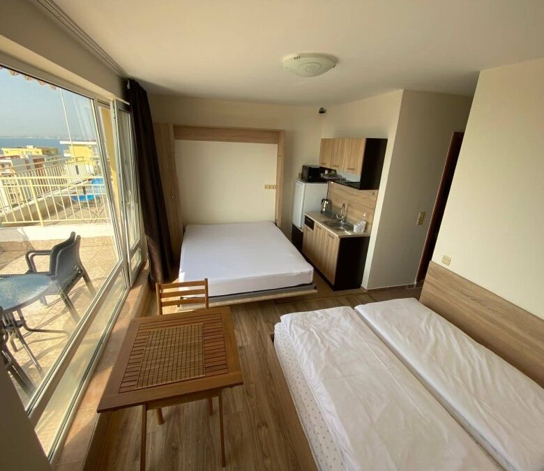 Bright studio apartment with large terrace and stunning sea views, located just 200m from the beach.