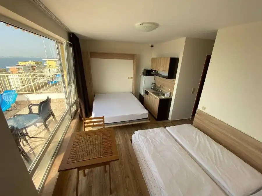 Bright studio apartment with large terrace and stunning sea views, located just 200m from the beach.