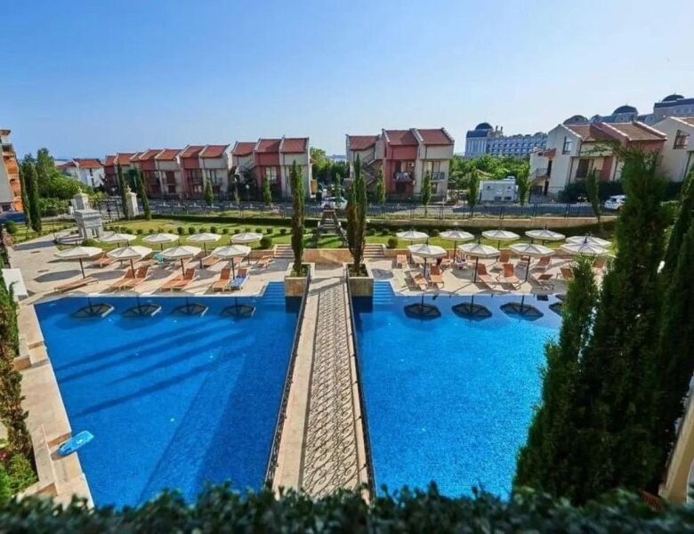 View of the swimming pool and surrounding apartments in Sveti Vlas, near the sea.